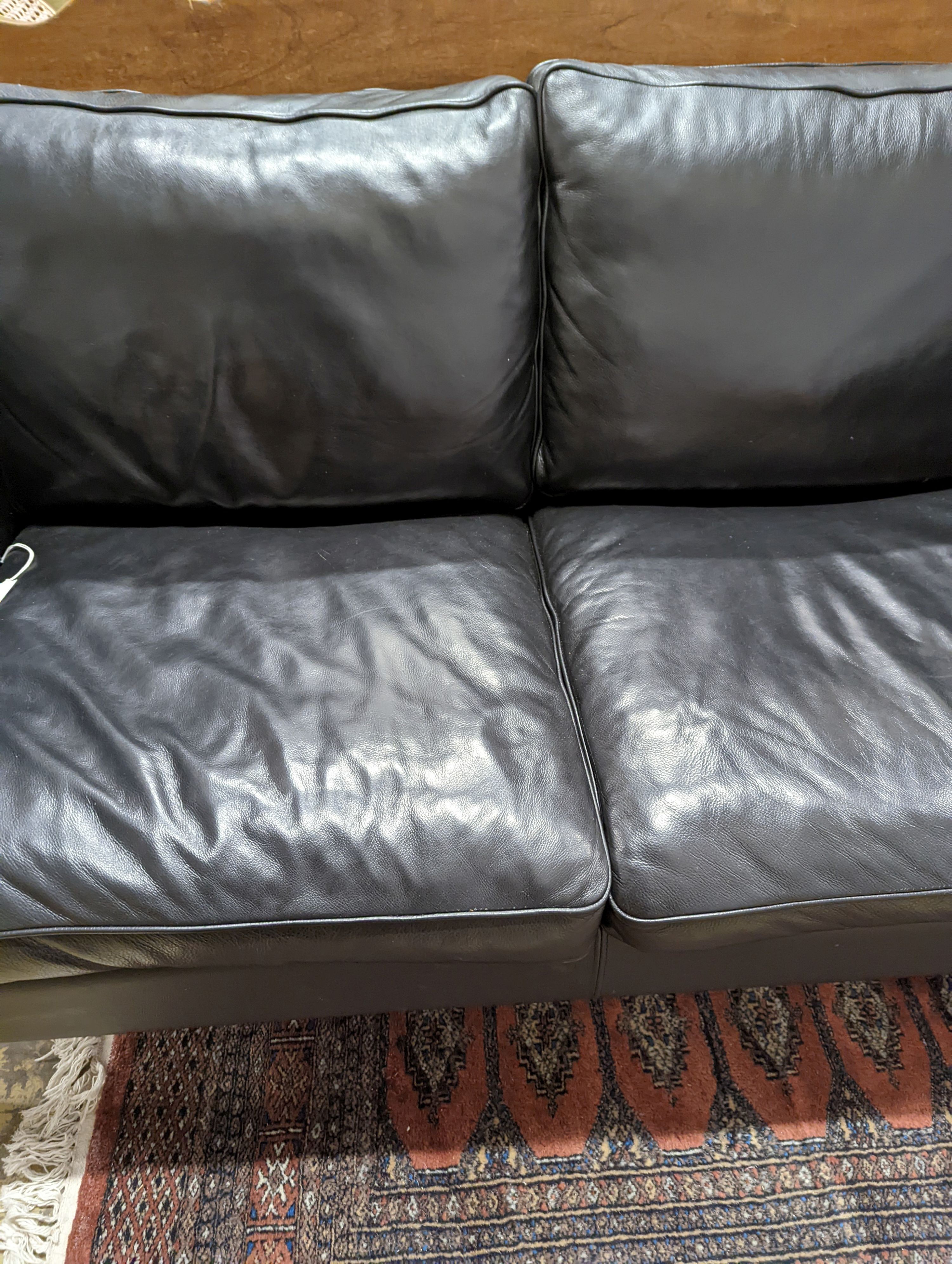 A Danish black leather two seater sofa in style of Borge mogensen, length 142cm, depth 83cm, height 80cm